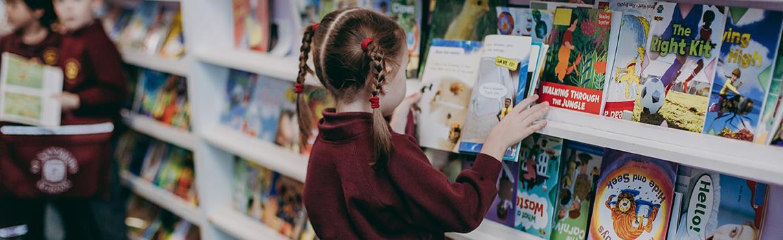 School girl in library